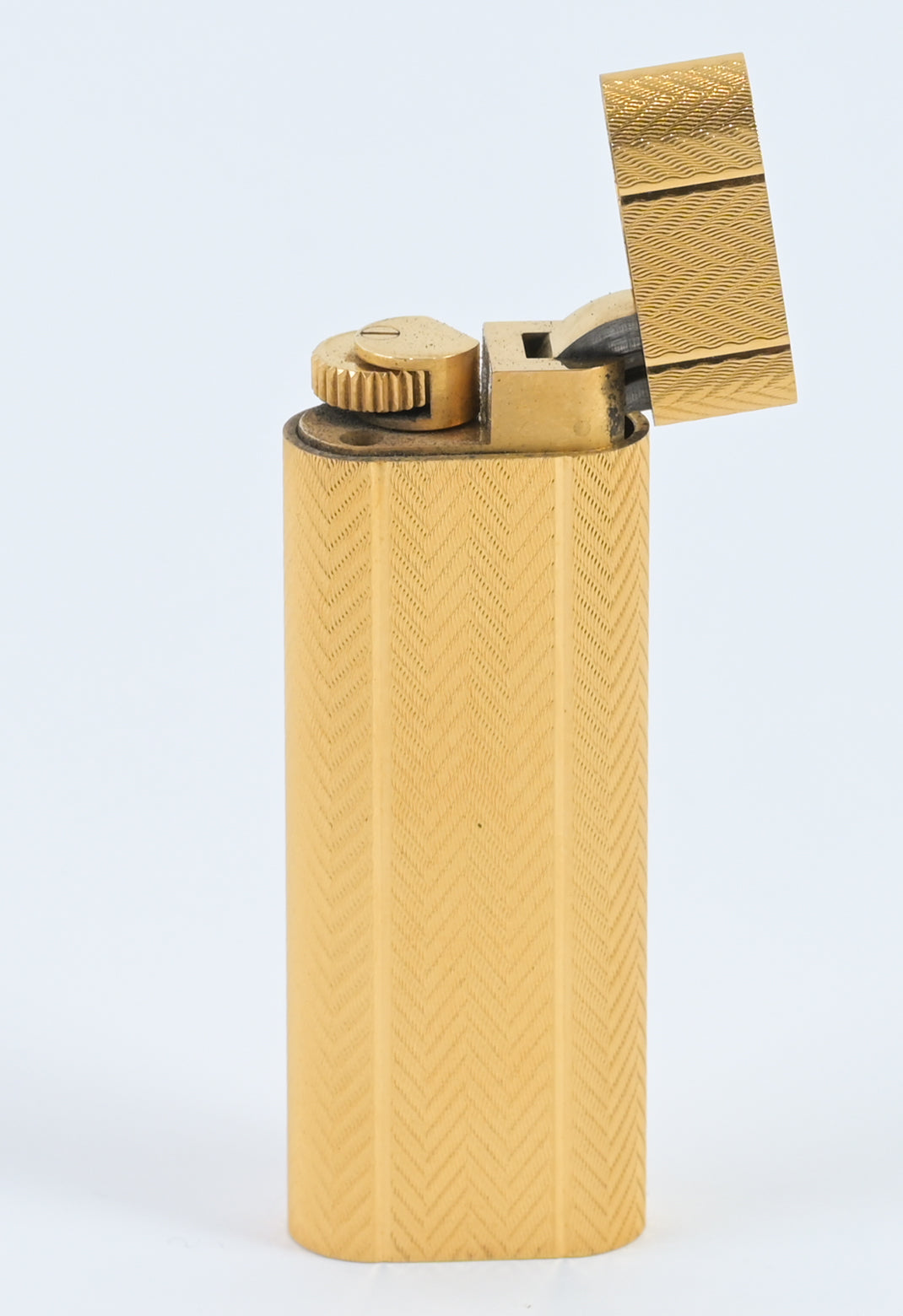 Cartier / Swiss 1970s must de cartier guilloché pattern brass lighter