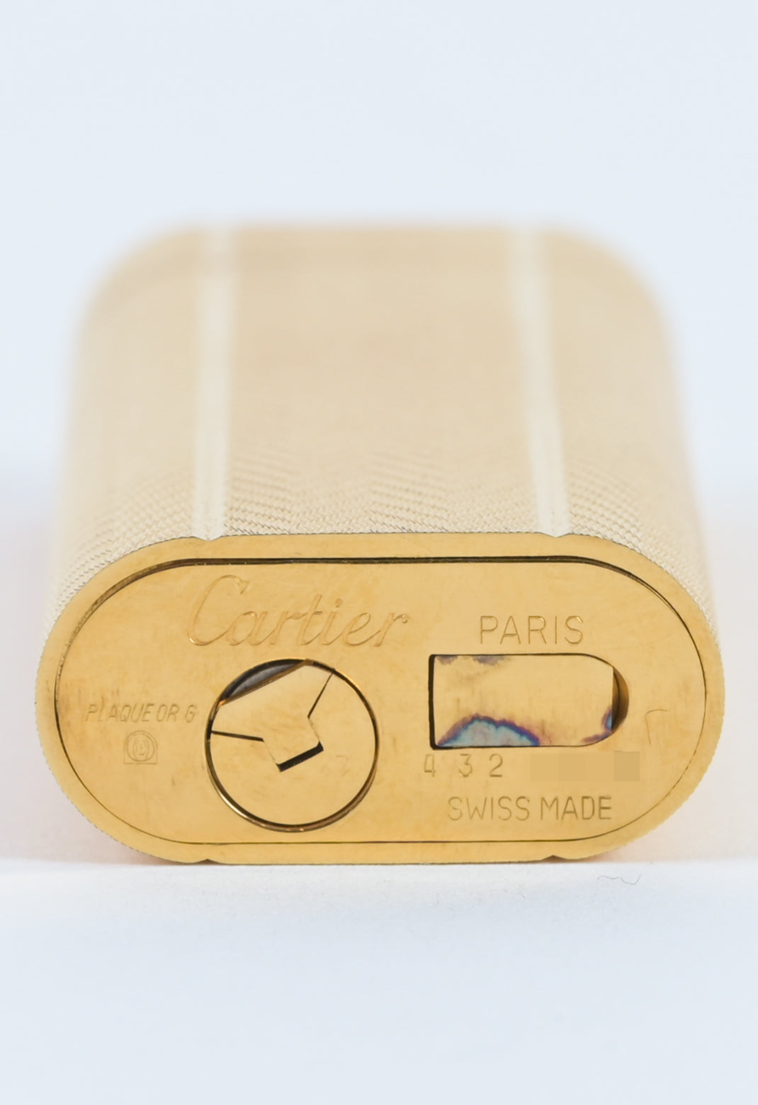 Cartier / Swiss 1970s must de cartier guilloché pattern brass lighter