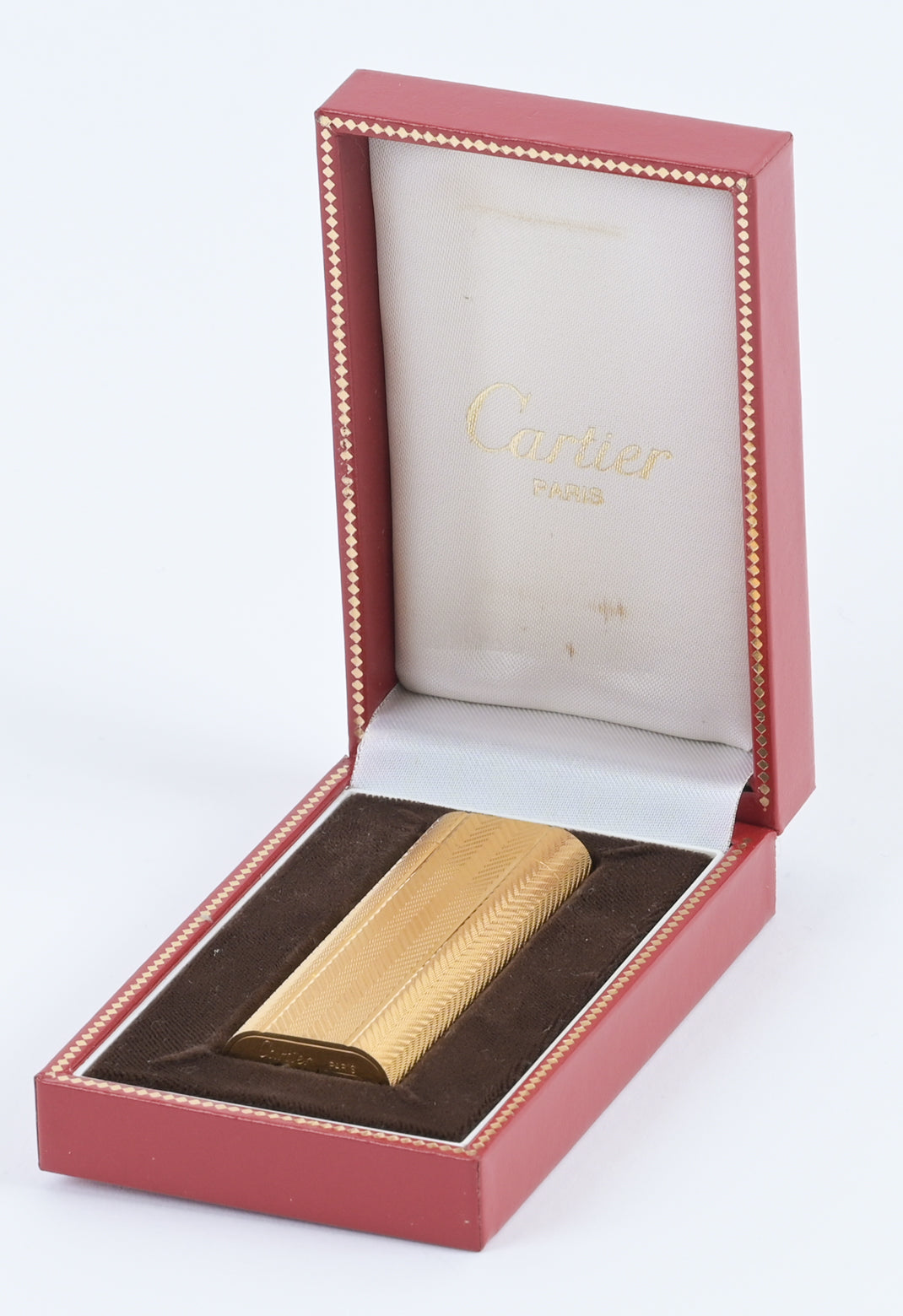 Cartier / Swiss 1970s must de cartier guilloché pattern brass lighter