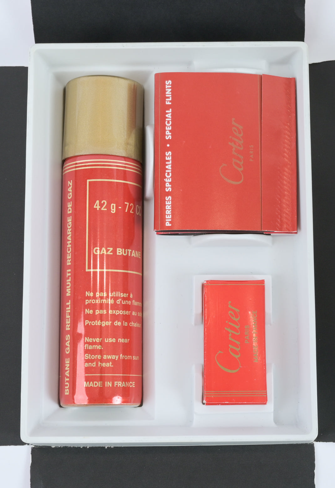 Cartier / Swiss 1970s must de cartier guilloché pattern brass lighter